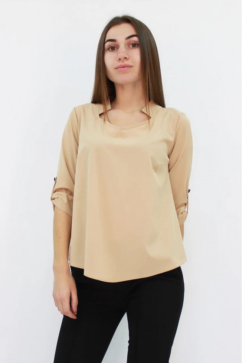 Стильна жіноча блузка вільного крою кольору бежева