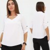 Стильна жіноча блузка вільного крою кольору біла